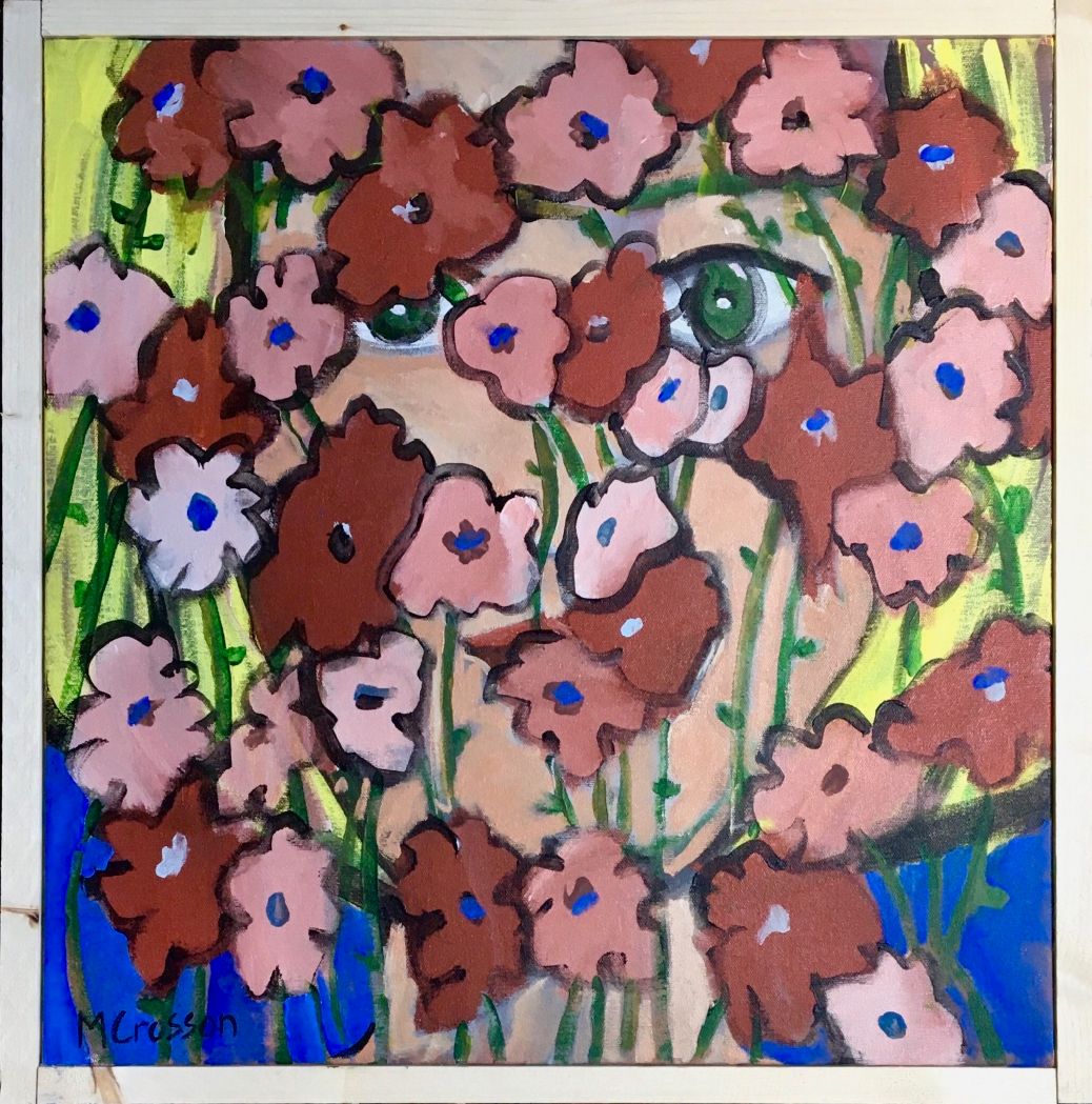 Framed painting of a woman peering through red and pink flowers.